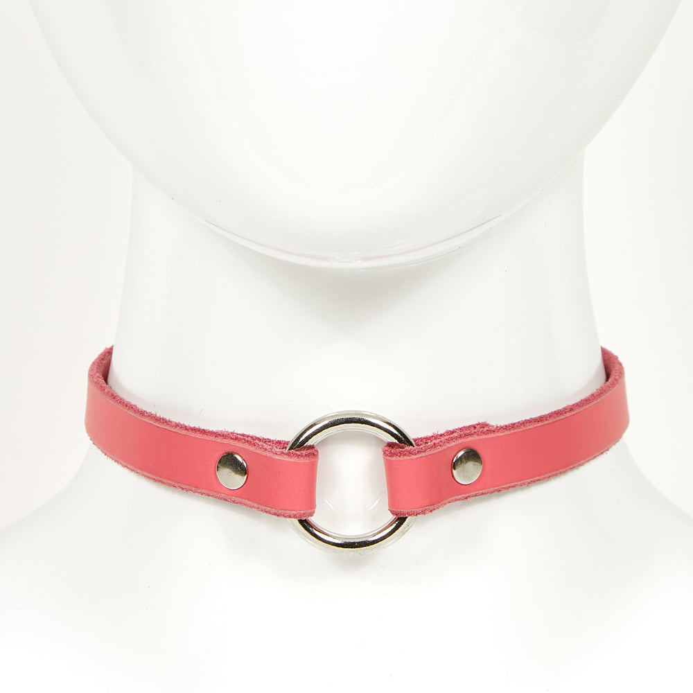 
                  
                    O-RING CHOKER SLIM front view of a pink leather necklace with silver circular ring, attached with silver rivets
                  
                
