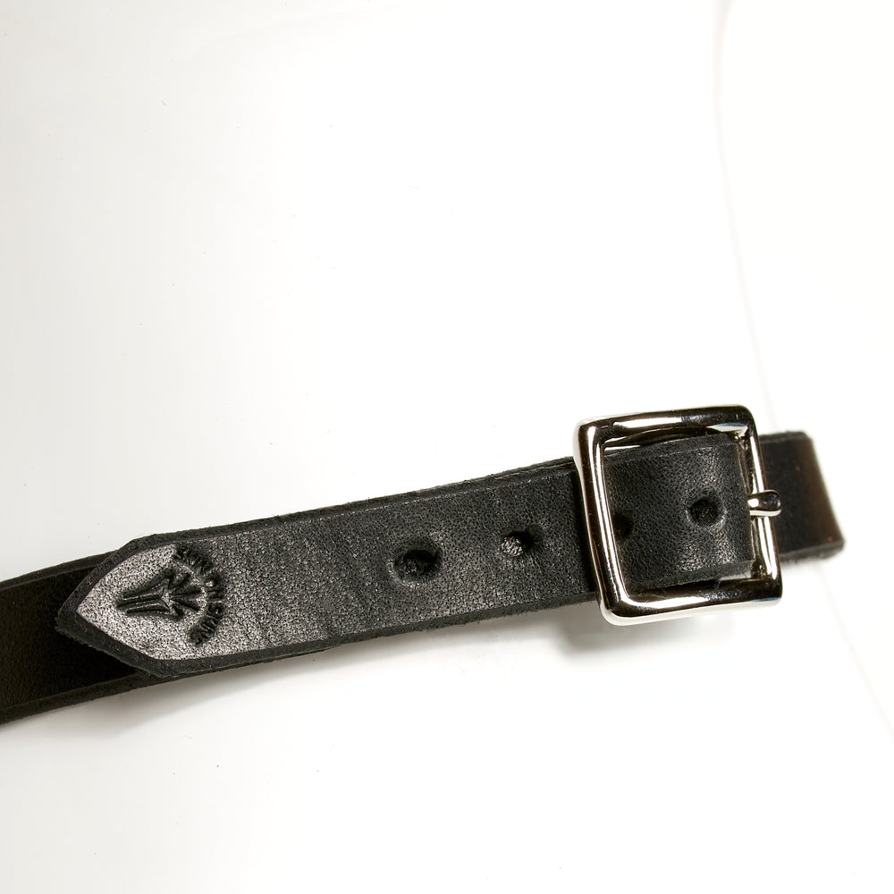 O-RING CHOKER SLIM rear view of a square silver buckle on black leather necklace strap, embossed with SKIN ON SKINS emblem