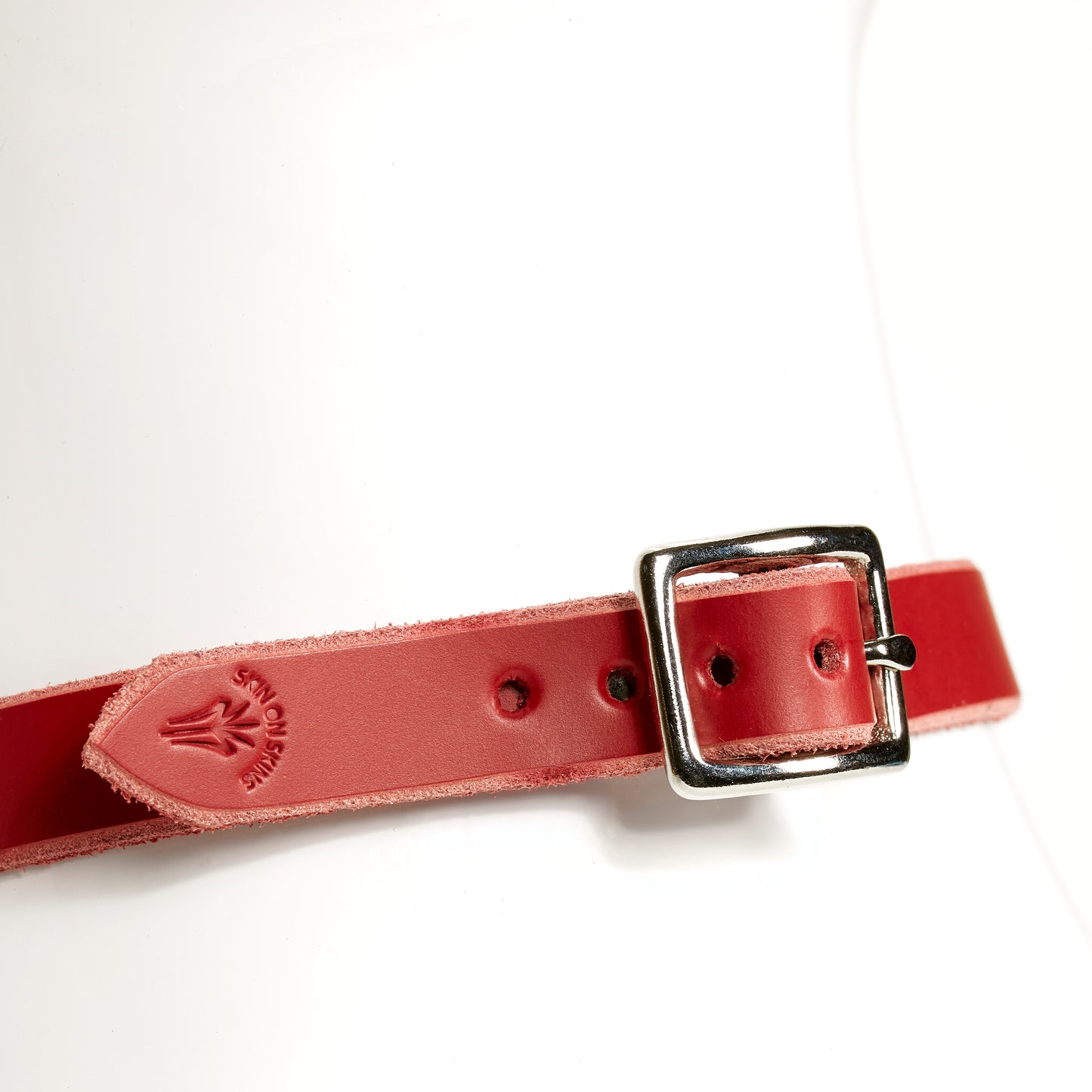 O-RING CHOKER SLIM rear view of a square silver buckle on red leather necklace strap, embossed with SKIN ON SKINS emblem