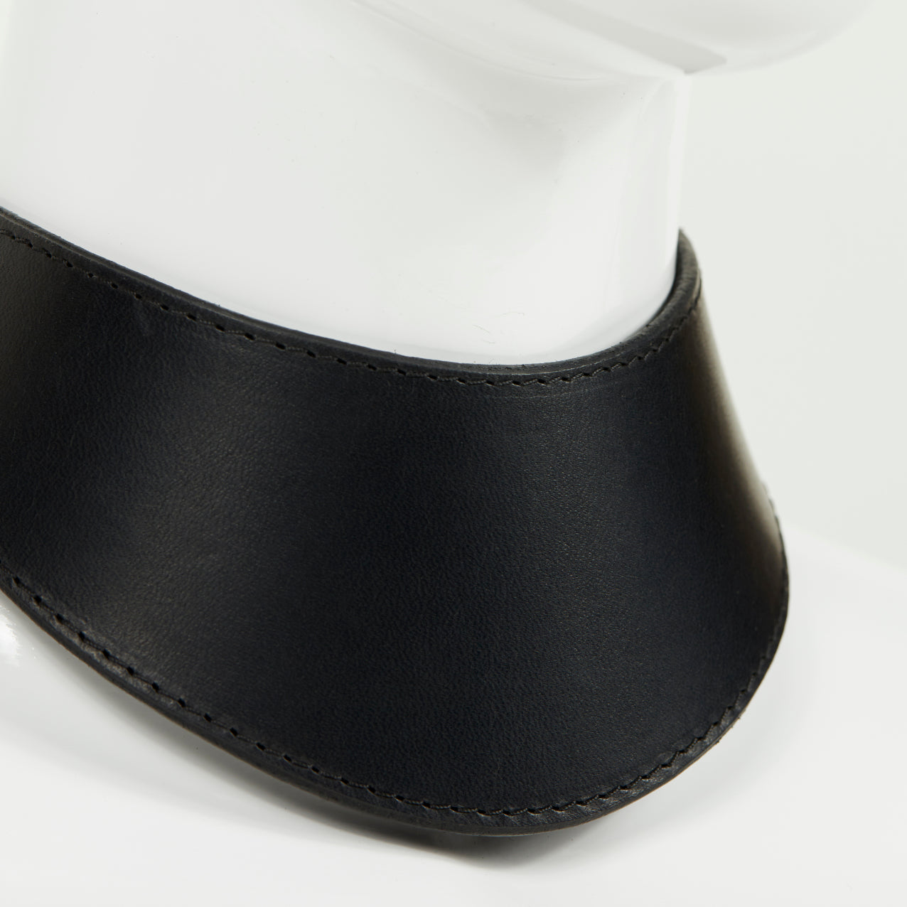 PLAY COLLAR 3/4 close front view of wide, curved style collar in black leather with black stitched edges