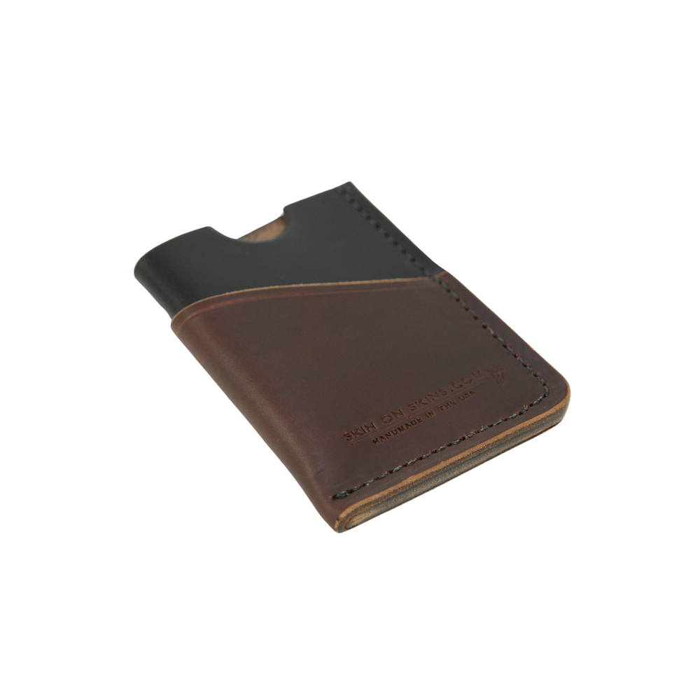 
                  
                    Front view of a rectangular wallet in a stylish, simple double-sleeve design, with debossed emblem, a black color base, and dark brown surface color
                  
                